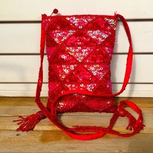 Little red beaded purse with tassels.